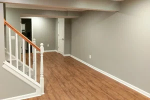 a room with a wood floor and a staircase